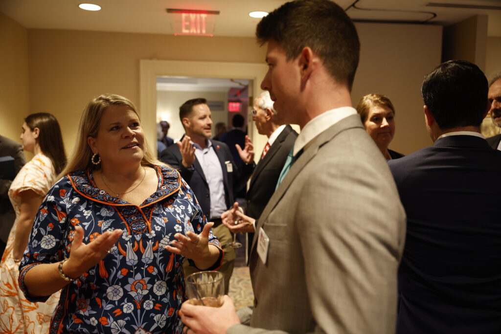 Citizens for Responsible Energy Solutions President, Heather Reams, talks with event attendee. 